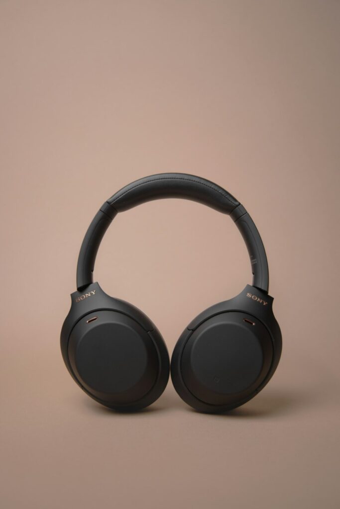 Bluetooth headphones on a desk waiting to pair with a Windows 11 PC