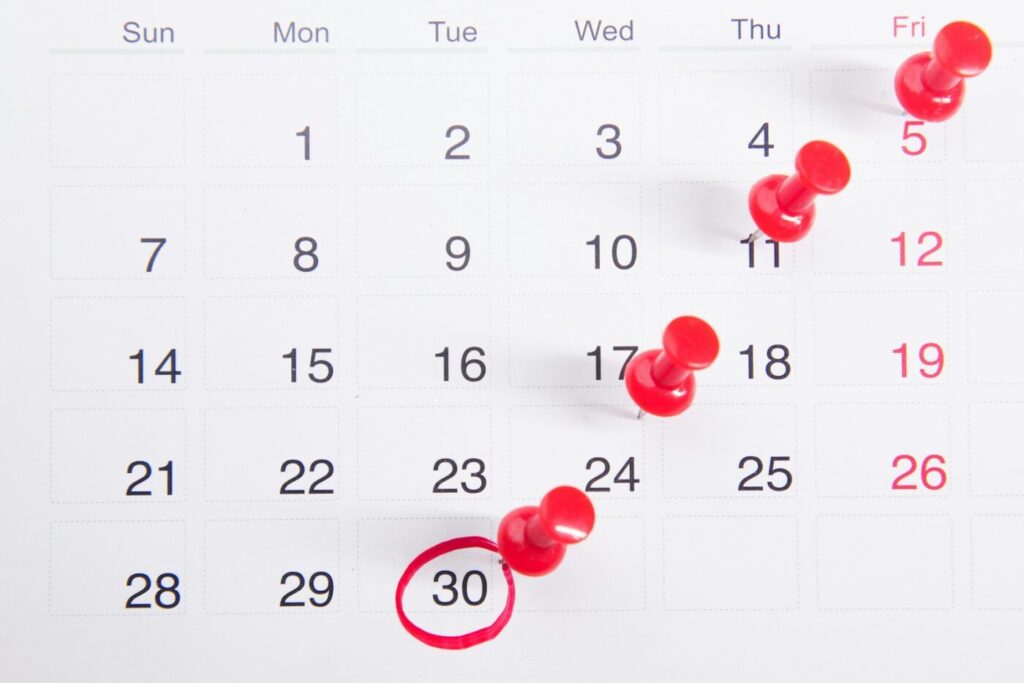 Calendar with pins showing booked appointments for a small business