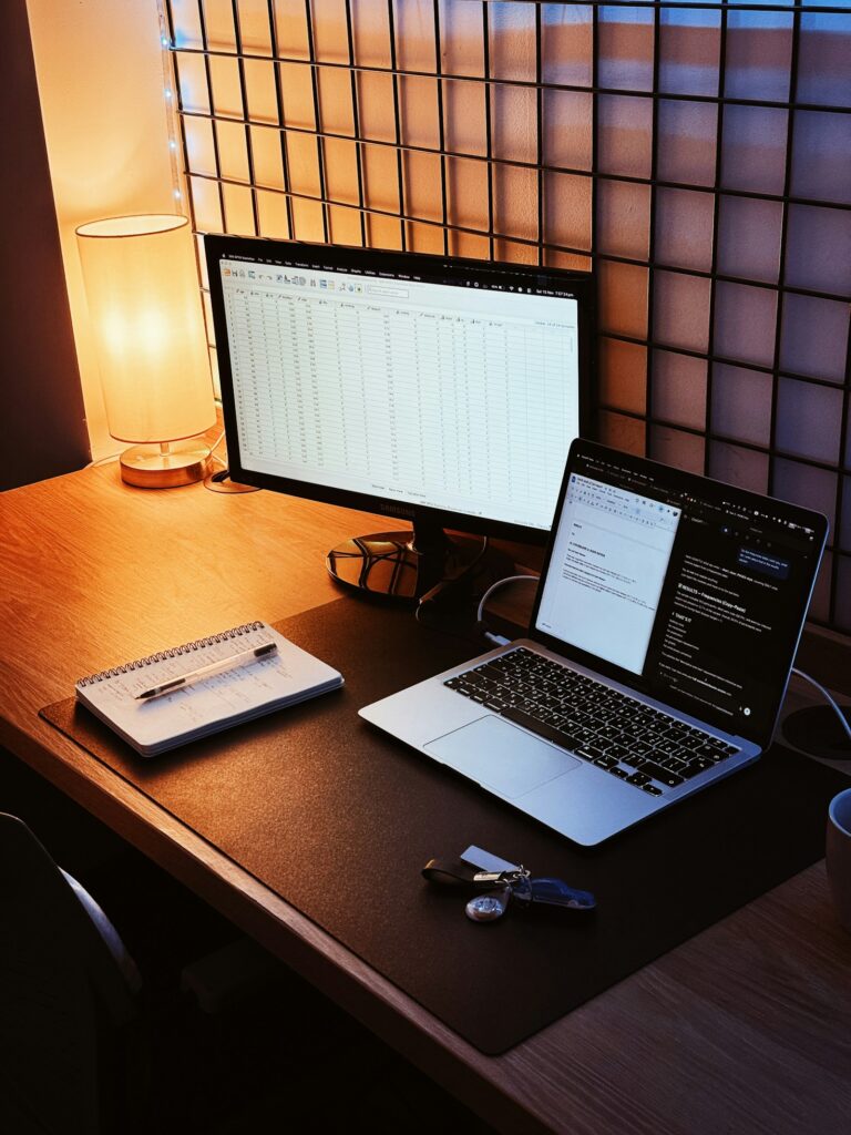 Desk with laptop and monitor where a USB device is being troubleshooted