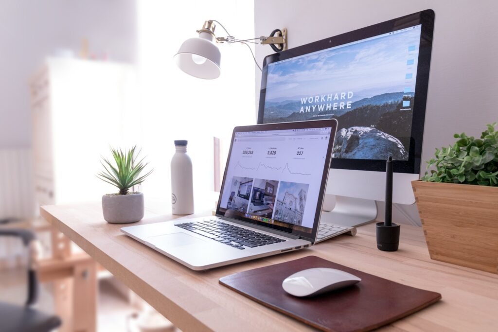 Laptop beside a desktop computer, where large files can be moved off drive C