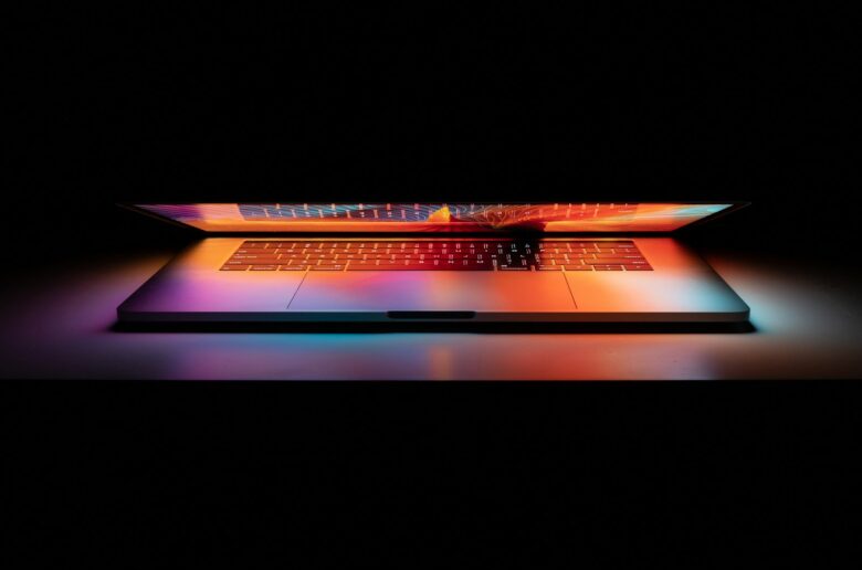 Laptop on a white desk, illustrating how to free up space on drive C