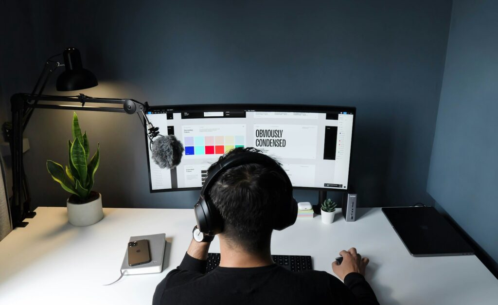 Video creator working at a computer with a free Premiere Pro alternative