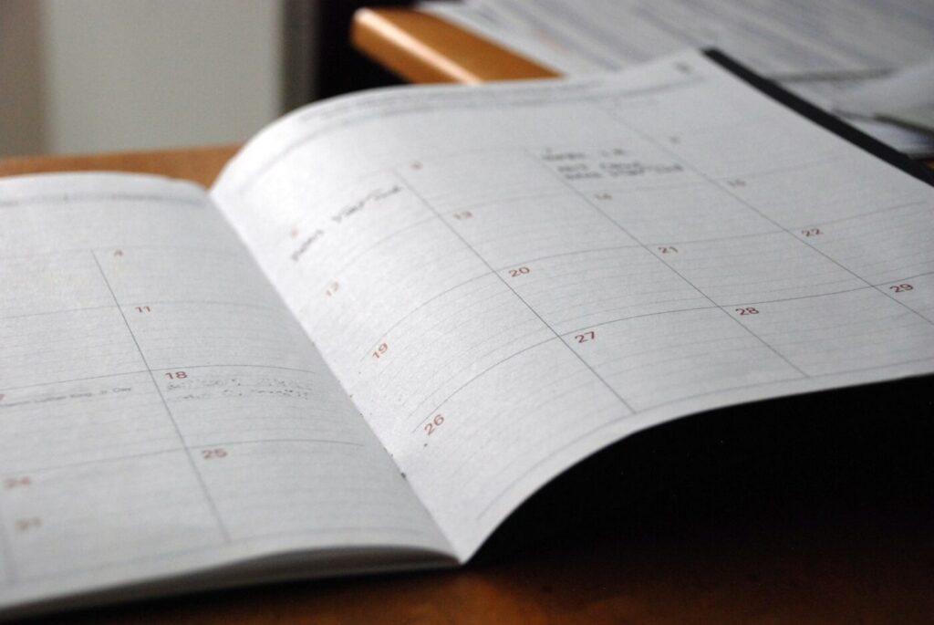 Monthly planner representing appointment scheduling software for small business