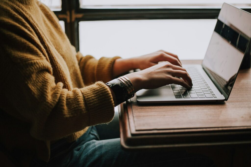 Person working on a laptop editing a short video on modest hardware