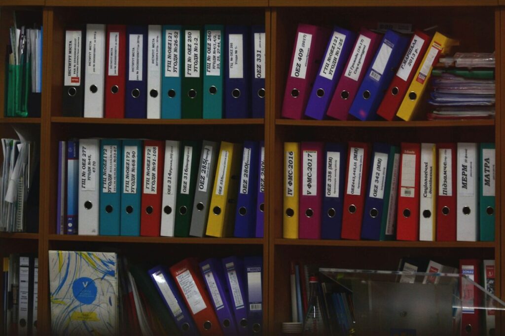 Organized binders representing a clean list after removing duplicates